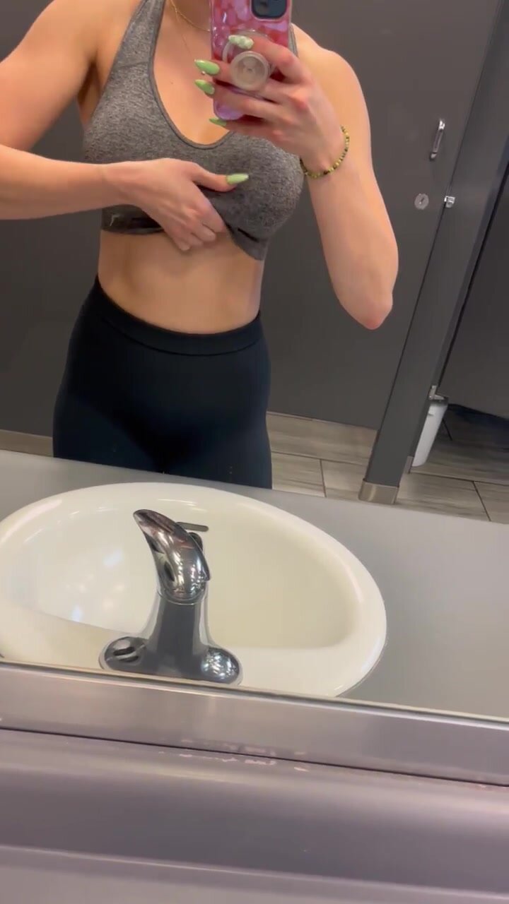 Pulling my Tits out in the locker room before the lady comes out of the stall
