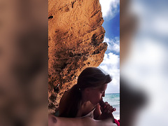 Sensual public blowjob on an incredibly beautiful beach.