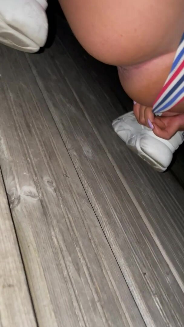 Desperate pee on lake bridge